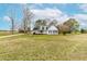 View of the house with a welcoming front porch and a sprawling front lawn at 44 Loop Rd, Archer Lodge, NC 27527