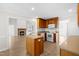 The kitchen has an island and a view to the living room with a fireplace at 44 Loop Rd, Archer Lodge, NC 27527