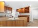 Well-lit kitchen with wood cabinetry and a spacious layout, ideal for cooking and entertaining at 44 Loop Rd, Archer Lodge, NC 27527