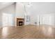 Spacious living room features a fireplace, built-in shelving, and light-colored wood flooring at 44 Loop Rd, Archer Lodge, NC 27527
