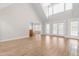 Bright, open living room featuring vaulted ceilings, light wood floors, and natural light at 44 Loop Rd, Archer Lodge, NC 27527