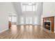 Inviting living room with fireplace, vaulted ceilings, and a seamless flow to the dining area at 44 Loop Rd, Archer Lodge, NC 27527
