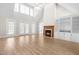 Spacious living room with a fireplace, built-in shelving, and lots of natural light at 44 Loop Rd, Archer Lodge, NC 27527