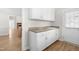 Functional mud room with white cabinets, sink, and convenient access to the backyard at 44 Loop Rd, Archer Lodge, NC 27527