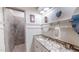 Bright bathroom with dual sinks, granite countertops, shower, and stylish fixtures at 468 Loftis Loop Rd, Roxboro, NC 27574
