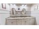Bright bathroom with dual sinks, granite countertops, and stylish fixtures at 468 Loftis Loop Rd, Roxboro, NC 27574