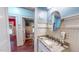 Well-lit bathroom with single sink and granite countertops at 468 Loftis Loop Rd, Roxboro, NC 27574