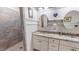 Bright bathroom with dual sinks, granite countertops, shower, and stylish fixtures at 468 Loftis Loop Rd, Roxboro, NC 27574