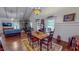 Dining Room with Hardwood Flooring, decorative lighting fixture, and Stone Accent Wall at 468 Loftis Loop Rd, Roxboro, NC 27574