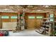 Spacious garage or workshop featuring insulated ceiling, convenient doors, and industrial ventilation system at 468 Loftis Loop Rd, Roxboro, NC 27574