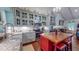 Charming kitchen boasts custom cabinetry, stainless steel appliances, a center island, and granite counters at 468 Loftis Loop Rd, Roxboro, NC 27574