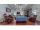 Inviting living room featuring hardwood floors, a stone fireplace, and comfortable seating at 468 Loftis Loop Rd, Roxboro, NC 27574
