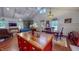 Open concept living area with kitchen island and stone fireplace feature at 468 Loftis Loop Rd, Roxboro, NC 27574