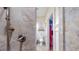 Bathroom shower with stone walls, showerhead, and view of the commode at 468 Loftis Loop Rd, Roxboro, NC 27574