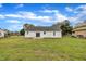 Well-maintained backyard with green grass and a patio at 503 N Sellers St, Selma, NC 27576