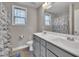 Updated bathroom featuring a double vanity, modern fixtures, and a shower with a marble curtain at 503 N Sellers St, Selma, NC 27576