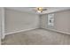 Bright and airy bedroom with neutral walls, plush carpeting, and a window with blinds at 503 N Sellers St, Selma, NC 27576