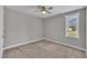Bedroom with neutral paint, carpet, ceiling fan and one window at 503 N Sellers St, Selma, NC 27576