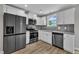 Modern kitchen equipped with stainless steel appliances, sleek countertops, and ample cabinet space at 503 N Sellers St, Selma, NC 27576