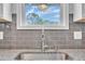 Kitchen sink with stainless steel faucet, granite countertops and view out the window at 503 N Sellers St, Selma, NC 27576