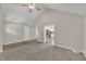 Open living room with access to the kitchen, neutral walls, vaulted ceiling and plush carpeting at 503 N Sellers St, Selma, NC 27576