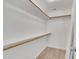 Well-organized walk-in closet with shelving for clothing storage at 503 N Sellers St, Selma, NC 27576