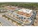 Aerial view of office buildings surrounded by roads and parking areas, showcasing commercial development at 508 Moore Hill Way, Holly Springs, NC 27540