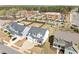 Aerial view of a home in a landscaped neighborhood, highlighting curb appeal and proximity to amenities at 508 Moore Hill Way, Holly Springs, NC 27540