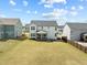Expansive backyard featuring a covered porch perfect for outdoor entertaining and relaxation at 508 Moore Hill Way, Holly Springs, NC 27540