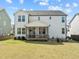 This home has a spacious green backyard with an outdoor lounge at 508 Moore Hill Way, Holly Springs, NC 27540