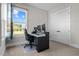 This bedroom has an office setup with dual monitors and a window at 508 Moore Hill Way, Holly Springs, NC 27540