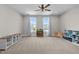 Bright bonus room featuring carpet, ceiling fan, and double windows offering great natural light at 508 Moore Hill Way, Holly Springs, NC 27540
