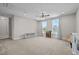 Large bonus room with carpeted floor, ceiling fan and natural light at 508 Moore Hill Way, Holly Springs, NC 27540