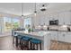 Spacious eat-in kitchen features an island with seating and stainless steel appliances at 508 Moore Hill Way, Holly Springs, NC 27540