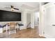Bright breakfast nook with booth seating, ceiling fan, and easy access to stairs and hall at 7708 Foxwood Dr, Raleigh, NC 27615