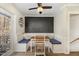 Cozy breakfast nook with wainscoting, built-in seating, and a chalkboard accent wall at 7708 Foxwood Dr, Raleigh, NC 27615