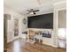 Breakfast nook featuring booth seating, ceiling fan, and a modern chalkboard wall accent at 7708 Foxwood Dr, Raleigh, NC 27615
