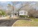 Charming two-story home with front yard landscaping and inviting covered front porch at 7708 Foxwood Dr, Raleigh, NC 27615