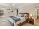 Comfortable main bedroom featuring a ceiling fan, carpet and a wooden headboard at 7708 Foxwood Dr, Raleigh, NC 27615