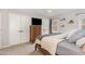 Bright main bedroom featuring carpet, a ceiling fan, and a wooden dresser at 7708 Foxwood Dr, Raleigh, NC 27615