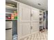 Built-in Murphy bed with shelving, storage, and mini fridge in a versatile space at 7708 Foxwood Dr, Raleigh, NC 27615