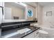 Bright bathroom with decorative window, modern fixtures, and tiled walls around the tub at 7825 Breckon Way, Raleigh, NC 27615