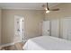This bedroom has an ensuite bath, ceiling fan, and double closets at 7825 Breckon Way, Raleigh, NC 27615