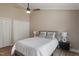 This bedroom features neutral tones, a ceiling fan, and double door closets at 7825 Breckon Way, Raleigh, NC 27615
