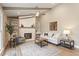 Cozy living room with fireplace, bright natural light, and open layout featuring a decorative ceiling fan at 7825 Breckon Way, Raleigh, NC 27615