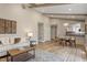 Spacious living room with hardwood floors, neutral tones, and view to the dining area at 7825 Breckon Way, Raleigh, NC 27615