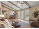 Bright, open living room with vaulted ceilings, exposed beams, and view to dining area at 7825 Breckon Way, Raleigh, NC 27615
