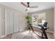 Well-lit home office featuring a modern desk, comfortable chair, and large window at 7825 Breckon Way, Raleigh, NC 27615