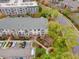 This aerial view shows a well-maintained building with balconies, landscaping, parking, and community walkways at 800 Moratuck Dr # 108, Raleigh, NC 27604