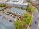 This aerial view shows a well-maintained building with balconies, landscaping, parking, and community walkways at 800 Moratuck Dr # 108, Raleigh, NC 27604